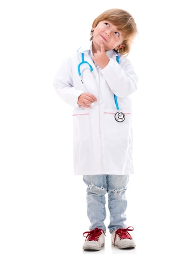 Pensive boy dressed as a doctor - isolated over white background