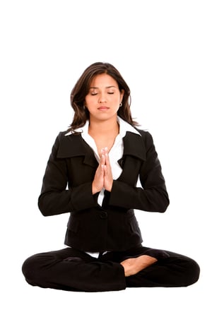 Business woman doing yoga isolated over a white background